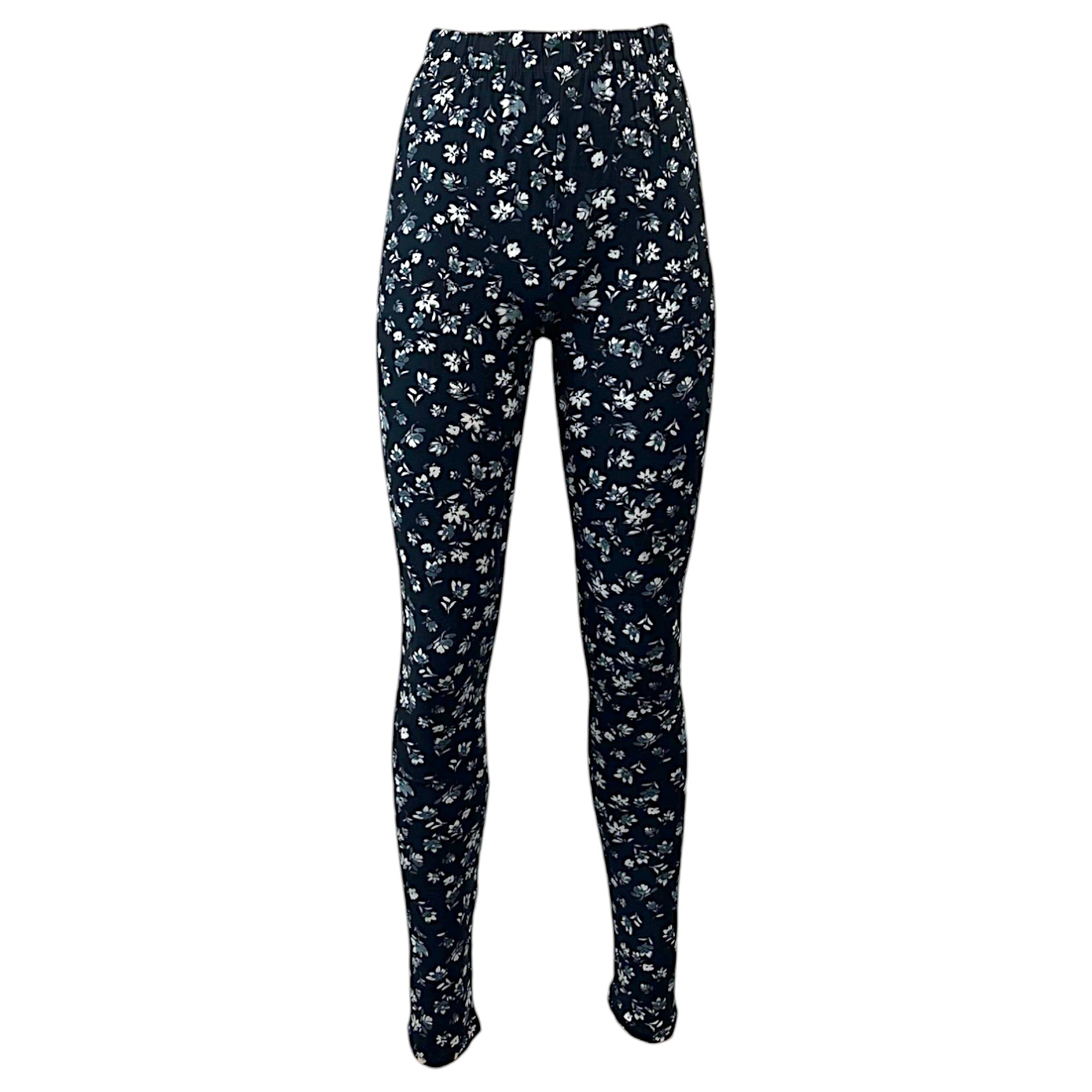 "Women's full-length women's leggings in black with white floral print, soft stretchy fabric, ideal for casual wear, yoga, and everyday outfits.